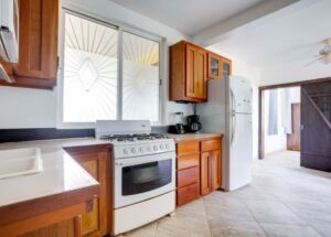 fully equipped kitchen has full sized appliances